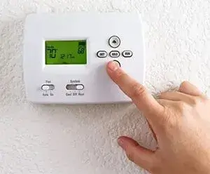 adjusting the thermostat 